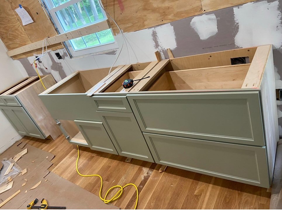 Kitchen cabinetry installation and preparation in progress