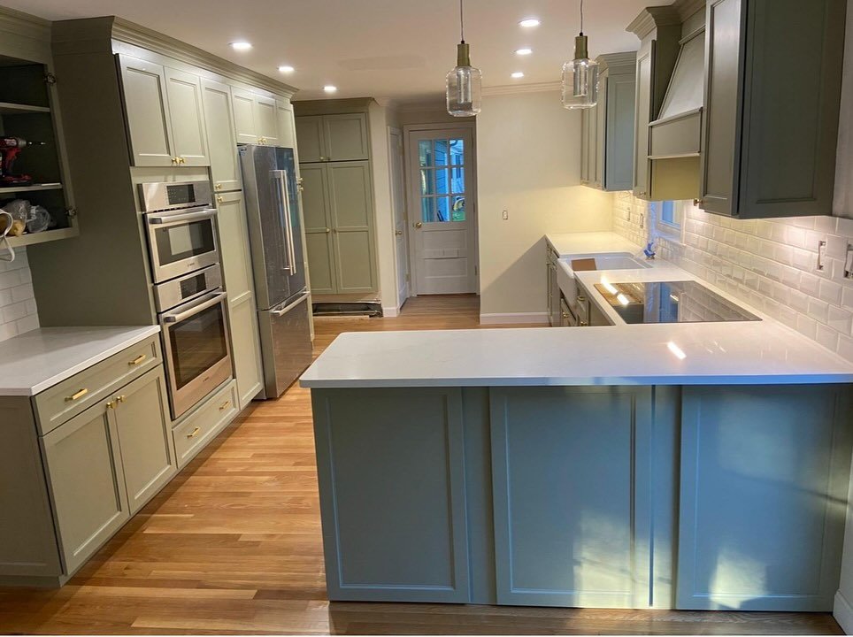 Completed kitchen renovation with custom cabinetry, counters and finished flooring